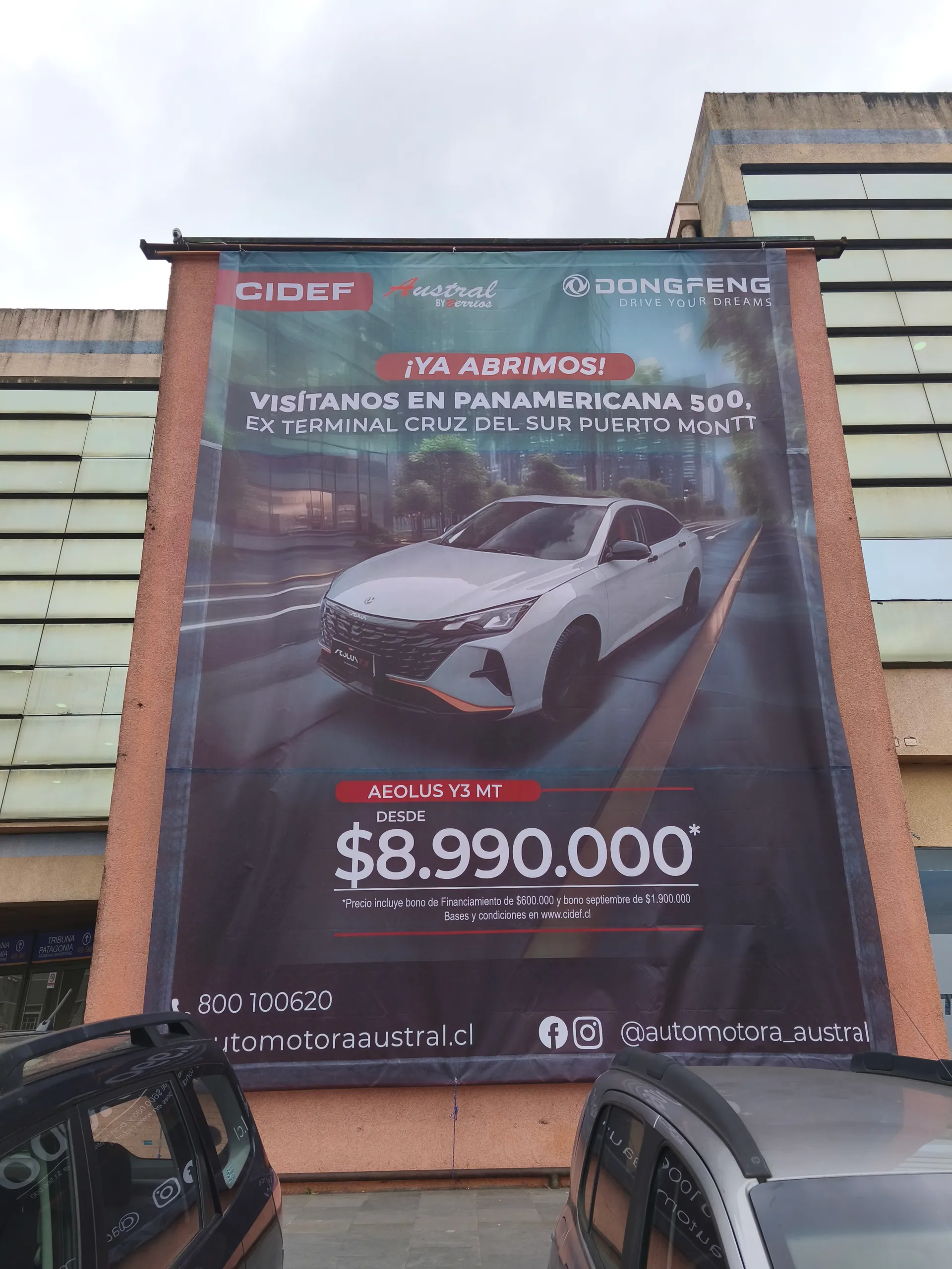 Gigantografía malla mesh Automotora Austral Dongfeng fachada Puerto Montt
